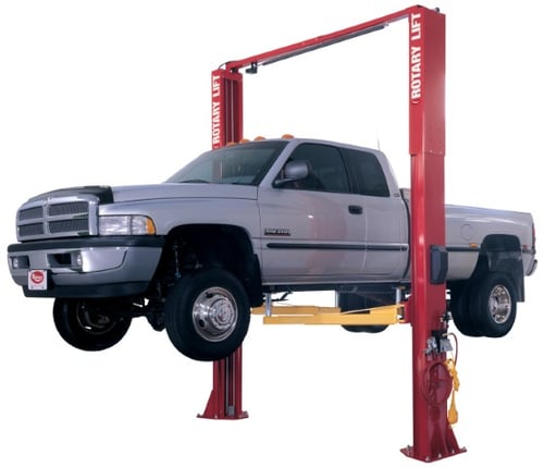 2 Post Car Lift with grey truck being lifted