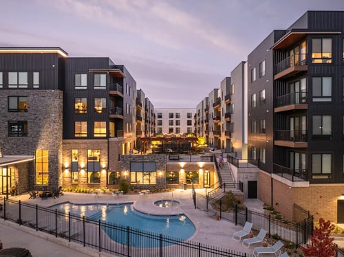 Property building with swimming pool and hot tub at Clove in Omaha, NE, 68114