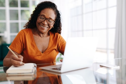 women working on her laptop