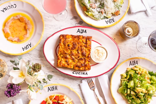 Indoor outdoor Italian dining and shared plates at Alba Spiaggia waterfront restaurant in Montauk.