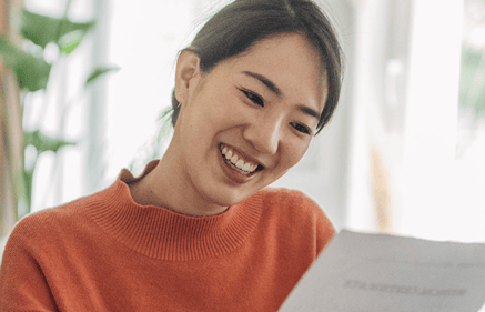 woman looking at bank document