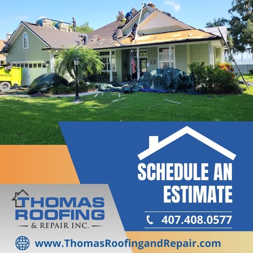Workers on the roof of a house replacing shingles. A sign in the foreground advertises Thomas Roofing & Repair, urging to schedule an estimate, with contact info and web address.