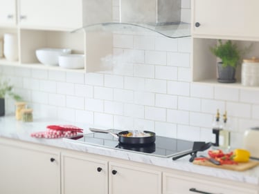 Cook top with pan cooking food