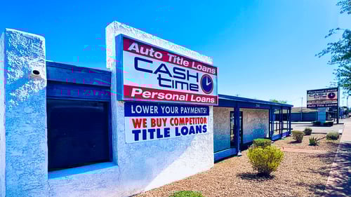 Cash Time Phoenix Camelback Road sign and storefront near I 17 at 21st Avenue offering title loan buyouts, registration loans, and personal loans with same day cash and fifteen minute approvals