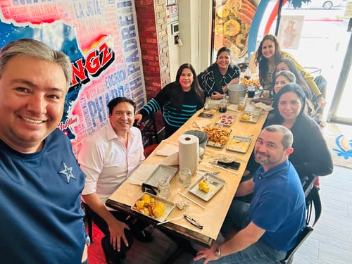 Agent Domingo and team members sitting at lunch