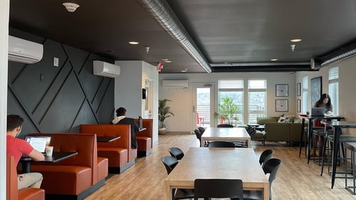 resident lounge with booth seats and open tables