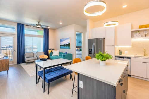 open concept living area with living room and kitchen at Zeta Luxury Apartments in Sacramento, CA