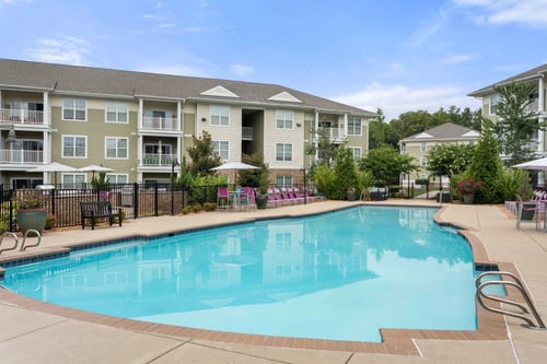 Resort style swimming pool with lounge seating at Colony at Centerpointe Apartments, Midlothian, 23114