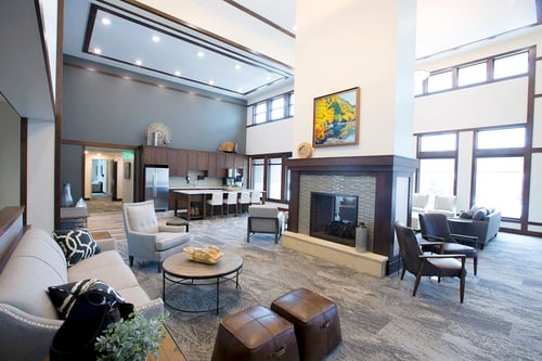 The Lodge, a separate building for residents, features a great room with comfortable furniture, plenty of seating, a two-sided fireplace, televisions and a business center.