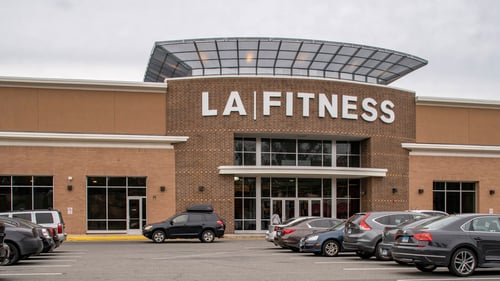 Full parking lot in front of LA Fitness at Stratford Square shopping center