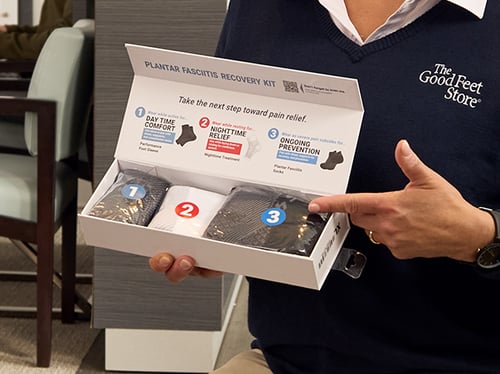 good feet store employee holding an OS1st box with socks