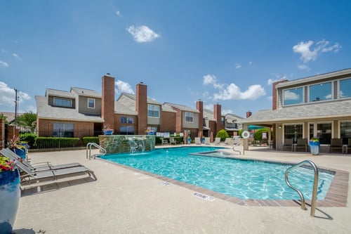 Swimming pool at Amberly Village Townhomes in Garland, TX 75040