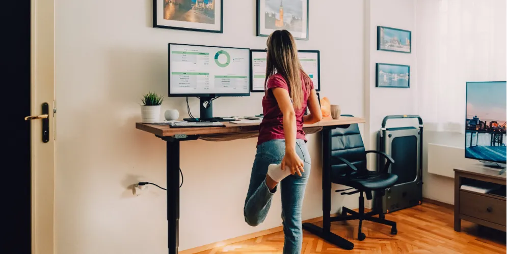 woman standing at her desk