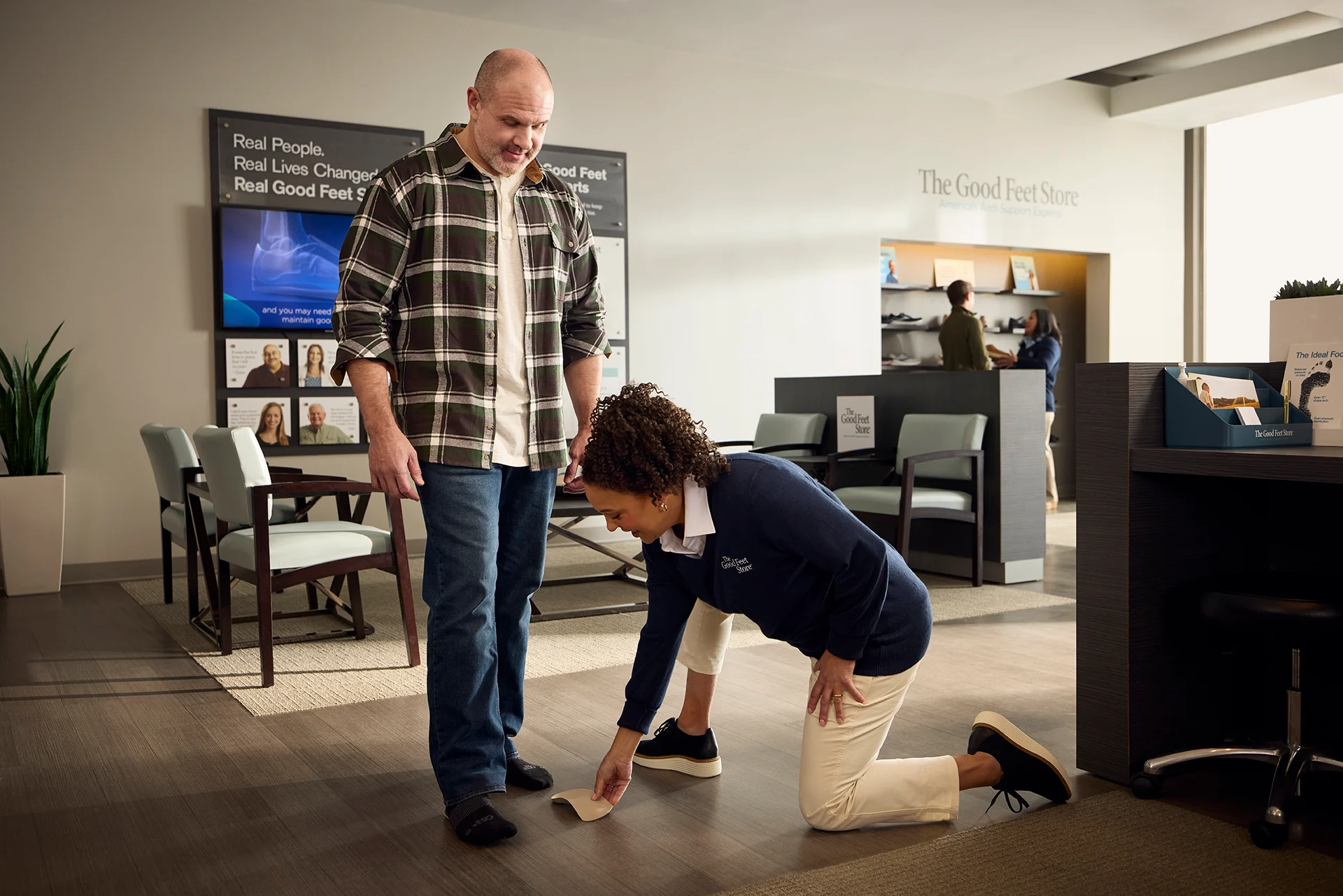 person getting an in-person evaluation at The Good Feet Store