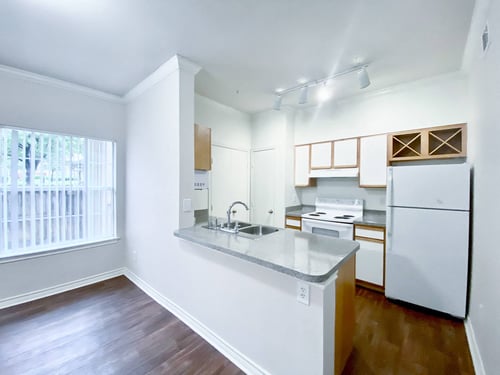 Interior kitchen with white cabinetry at Tuscany Square, Dallas, TX