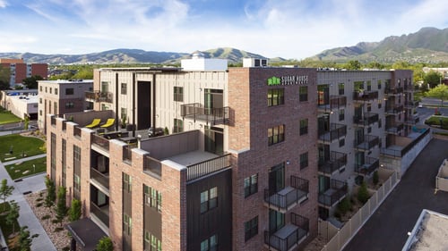 a rendering of a building with a blue sky in the background at Sugar House Apartments By Urbana, Salt Lake City, UT, 84105