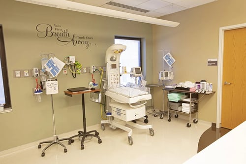 A hospital infant warmer and other safty equipment in our nursery