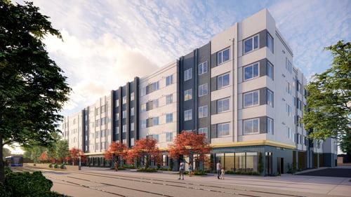 A modern multi-story building with a mix of grey and white exterior and a yellow accent on the ground floor at Rivo Apartments, Sacramento, 95815