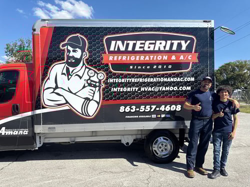 Integrity Refrigeration & A/C team members with the service truck