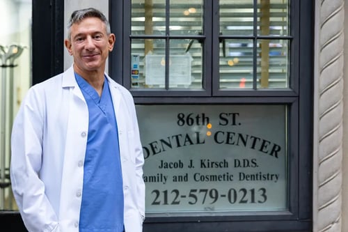 Dr. Kirsch standing in front of his office, 86th Street Dental Center