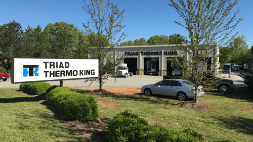 View from outside. Store sign and bays.