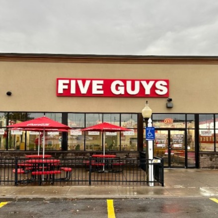 Exterior photograph of the entrance to the Five Guys restaurant at 1290 Arsenal Road in Watertown New York.