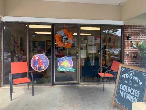 Front view of the school building with a welcoming entrance, designed to create a safe and friendly environment for children and families.