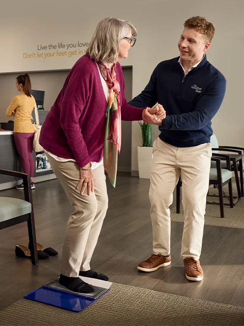 man helping woman
