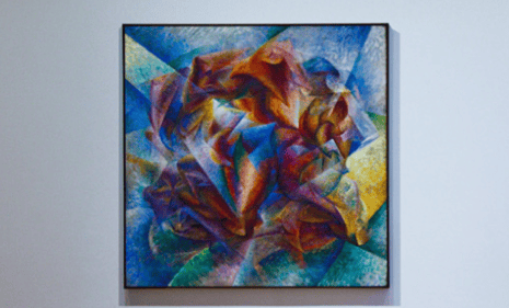 piece of abstract art hanging in a museum