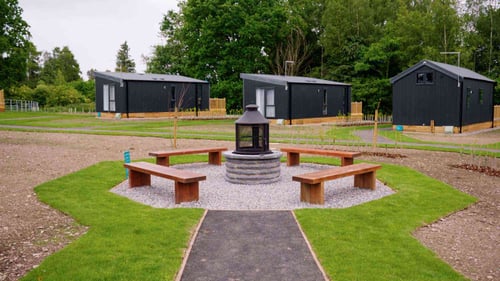 Lady Margaret's Park Deluxe glamping pods and communal fire area