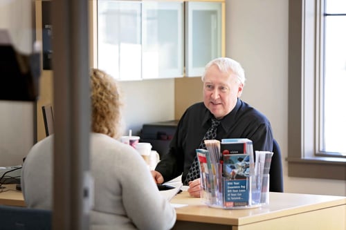 Photo of a River Valley Credit Union employee helping a member.