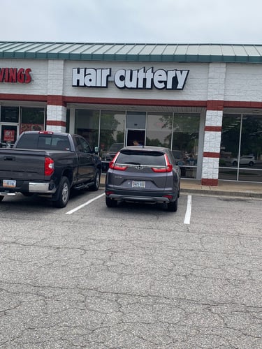 The front entrance of Hair Cuttery at Holland Windsor Crossing.