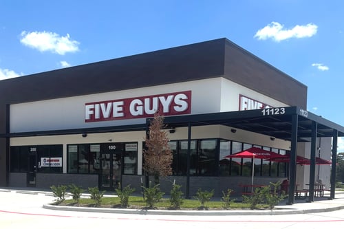 Exterior photograph of the Five Guys restaurant at 11123 West Airport Boulevard in Stafford, Texas.
