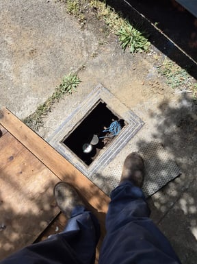 the water meter at the curb is inspected to verify the presence and location of a leak