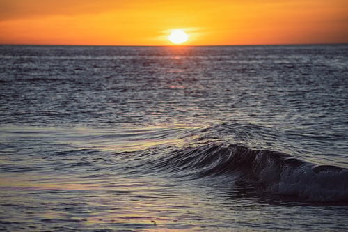 Waves that contrast with the Sun, depicting the flow of how flexible we are with our methodology like a river