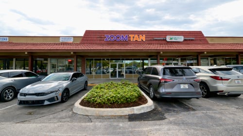 Zoom Tan Palm Beach Gardens Storefront