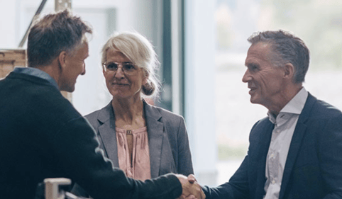 older couple having meeting with business partner