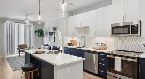 Kitchen and living room with white and blue theme