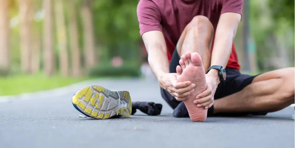 active person trying to relieve foot arch pain