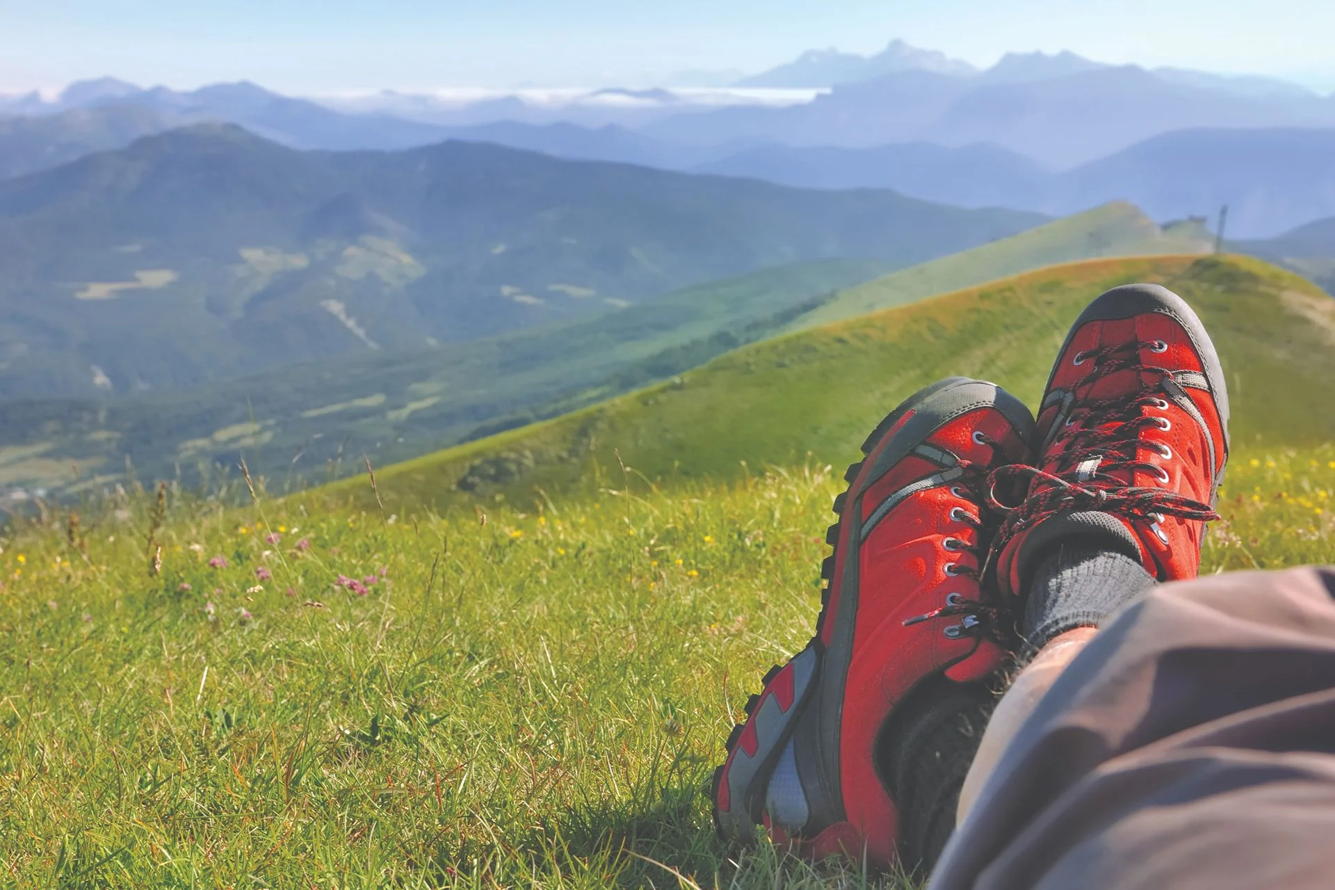 person overlooking terrain that is not easy to hike in flat feet