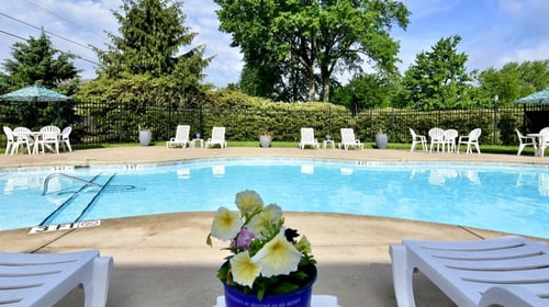 Sparkling Pool with Lounge Chairs at River Run Apartments in Warren, OH