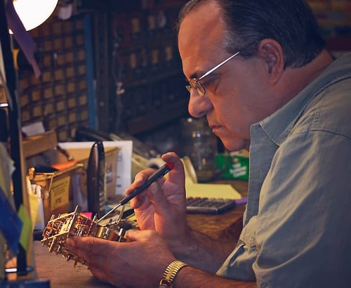 Jim Ebert works on  an antique clock at Ebert's Clocks in Ohio.