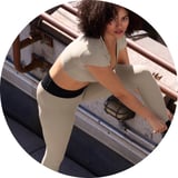 woman stretching wearing leggings