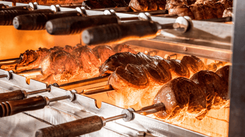 All of our meats are cooked the gaucho way - over an open flame with natural wood charcoal.