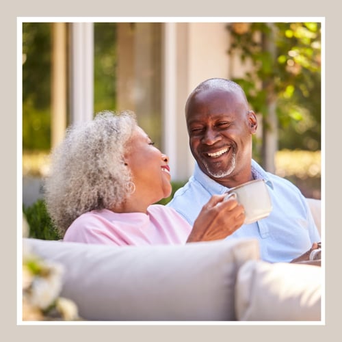 couple laughing together over coffee