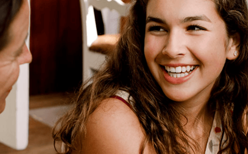 young woman smiling at mother