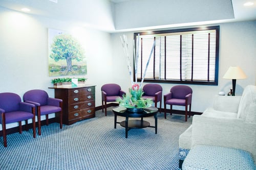 inside dental reception area chairs window