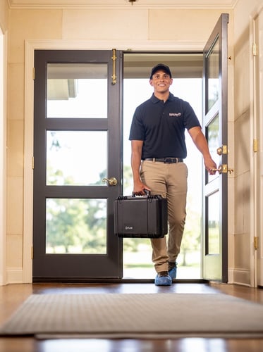 Tech walking into home ready to help