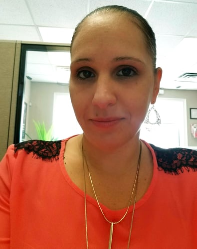 Cindy smiling in red and black shirt